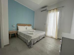 เตียงในห้องที่ Apartments Punta Grossa