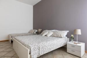 Łóżko lub łóżka w pokoju w obiekcie Portobello Apartments
