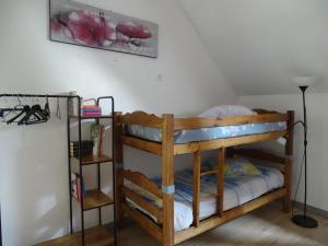a bedroom with two bunk beds in a room at Le gîte de l'AA in Renty