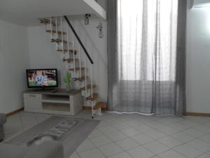 A television and/or entertainment centre at Casa Catania Inn