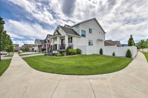 a large white house with a white fence at Beautiful and Updated Apartment in Heber City! in Heber City