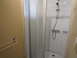 a bathroom with a shower and a toilet and a sink at Gîte Charentais avec Terrasse, Jardin et Randonnées - Idéal Familles et Animaux Acceptés - FR-1-653-177 in Salles-Lavalette