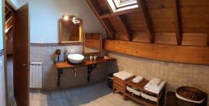 a bathroom with a sink and a mirror at Excelsior. Espectacular y exclusivo apartamento en Sallent de Gállego. in Sallent de Gállego