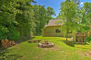 a house with a fire pit in the yard at Mountain View Home Hike, Raft, Golf and More! in Bryson City
