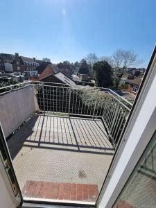 a balcony with a gate on top of a building at Lovely 2 bedroom flat in North West London in Hendon
