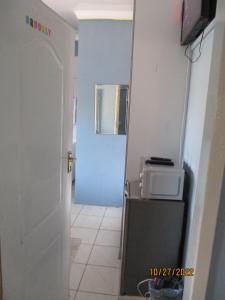Eldhús eða eldhúskrókur á PS GOOD TIME GUEST HOUSE 53 ALDRED STREET FREEMANVILLE KLERKSDORP