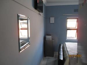 Sjónvarps- og/eða afþreyingartæki á PS GOOD TIME GUEST HOUSE 53 ALDRED STREET FREEMANVILLE KLERKSDORP
