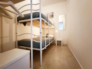 a bedroom with two bunk beds in a room at Casa Alexandra in Castelsardo +46 photos
