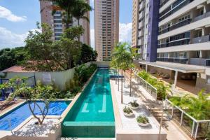an overhead view of a swimming pool in a building at The Expression 112 in Goiânia