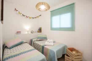 Łóżko lub łóżka w pokoju w obiekcie Apartamento Playa Torrox