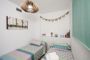 Łóżko lub łóżka w pokoju w obiekcie Apartamento Playa Torrox