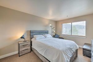 a bedroom with a large bed and a window at Park City Condo with View - Walk to Shops and Dining in Park City