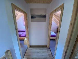 Postel nebo postele na pokoji v ubytování Apartmány Pod Kopcem