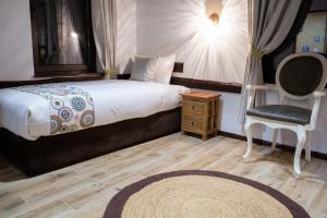 A bed or beds in a room at The Legends , Art & Forest