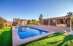 a swimming pool in the backyard of a house at Awesome Home In Molina De Segura With Kitchen in Molina de Segura