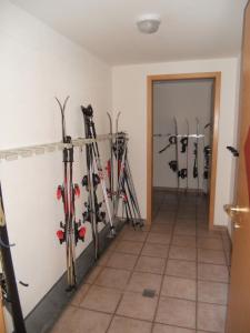 a room filled with lots of skis on a wall at Appartement beim Brunnen 12 in Sölden