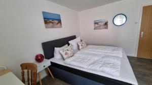 Katil atau katil-katil dalam bilik di Nordseeblick 1 - XXL Ferienwohnung