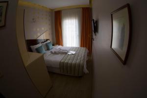 Postel nebo postele na pokoji v ubytování Ottoman Time Hotel