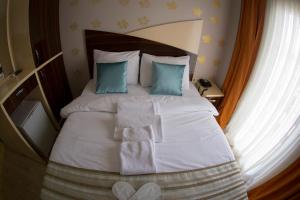 Postel nebo postele na pokoji v ubytování Ottoman Time Hotel