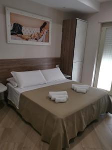 Кровать или кровати в номере ESPERIA B&B
