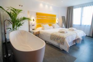 Łóżko lub łóżka w pokoju w obiekcie Laguna Home & Suites