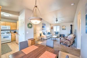 a kitchen and living room with a table and chairs at Anacortes Condo about 1 Mi to Marina and Fidalgo Bay! in Anacortes