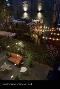 an outdoor patio with lights and a court yard at CUTE & COZY/TQL stadium/ Findlay Market/Brewery in Cincinnati