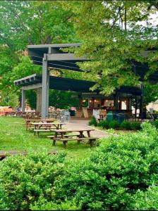 a group of picnic tables in a park at CUTE & COZY/TQL stadium/ Findlay Market/Brewery in Cincinnati