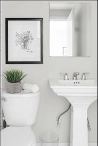 a bathroom with a white toilet and a sink at CUTE & COZY/TQL stadium/ Findlay Market/Brewery in Cincinnati