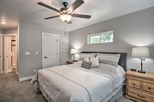 a bedroom with a bed and a ceiling fan at Gorgeous Loveland Townhome Less Than 1 Mi to Downtown in Loveland