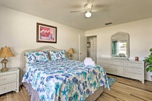 a bedroom with a bed and two dressers and a mirror at Kissimmee Home with Game Room, 7 Mi to Disney Parks! in Orlando