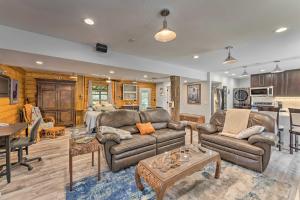 a living room with a couch and a table at Cozy Wisconsin Studio, 11 Mi to Lake Geneva! in Burlington