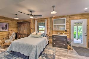 a bedroom with a bed and a dresser and a window at Cozy Wisconsin Studio, 11 Mi to Lake Geneva! in Burlington