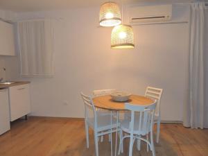 a kitchen with a table and chairs in a room at Suite La Savina Formentera con vistas al mar in La Savina