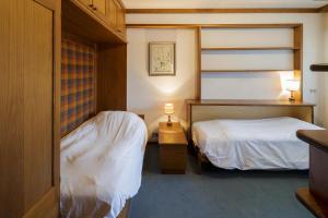 Ένα ή περισσότερα κρεβάτια σε δωμάτιο στο Villa Pocol - Stayincortina