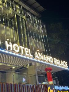 a hotel amending palace sign in front of a building at Hotel Anand Palace in Shirdi
