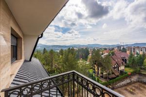 a balcony with a view of a city at Apartman M61 Lux&Spa,vila Elsa 2 in Zlatibor