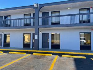 an empty parking lot in front of a building at Jameson Inn Conyers in Conyers