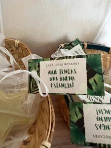 a basket filled with green bags with signs on it at Casa Lires Recarey in A Coruña