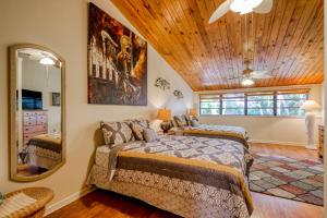 a bedroom with two beds and a mirror at Escape to the Keys in Islamorada +21 photos