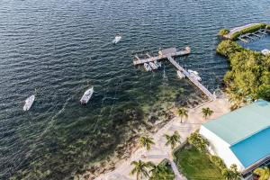 an aerial view of a dock with boats in the water at Escape to the Keys in Islamorada