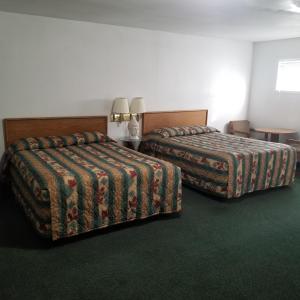 Postel nebo postele na pokoji v ubytování Budget 8 Motel