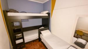 Postel nebo postele na pokoji v ubytování Lamparina Hostel
