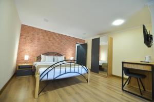 Postel nebo postele na pokoji v ubytování Madin Eco Hotel