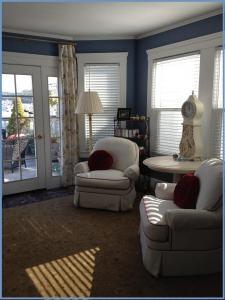 a living room with two chairs and a table at Beautiful Edwardian Victorian Homestay B&B in San Francisco