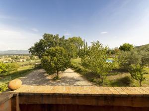 a view from the balcony of a house with trees at Private villa with swimming pool in the heart of Umbria in Bevagna
