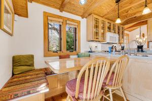 a kitchen with a counter and chairs in a room at The Potato House in Banner Elk