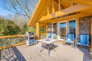a patio with a grill and chairs on a house at The Potato House in Banner Elk +22 photos