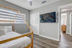a bedroom with a bunk bed in a room at Suwannee Lane in Cocoa Beach