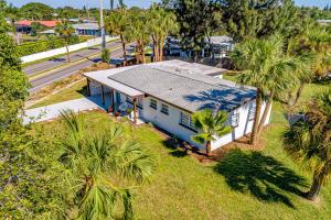 an overhead view of a blue house with palm trees at Suwannee Lane in Cocoa Beach